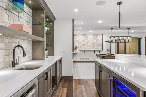 Wet bar, complete with mini dishwasher, a wine cooler, and mini beverage fridge.