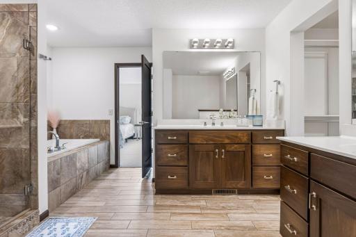 Private primary suite, with jacuzzi tub and separate step-in shower.