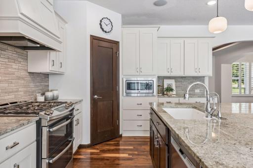 Double basin sink with built-in cutting board and garbage disposal.
