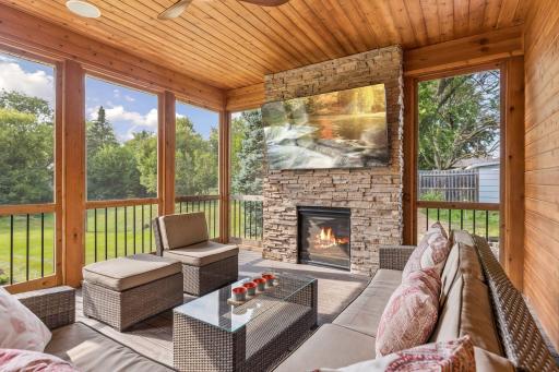 Screened porch expands the living space even in cooler months, with a gas fireplace and tv mount.