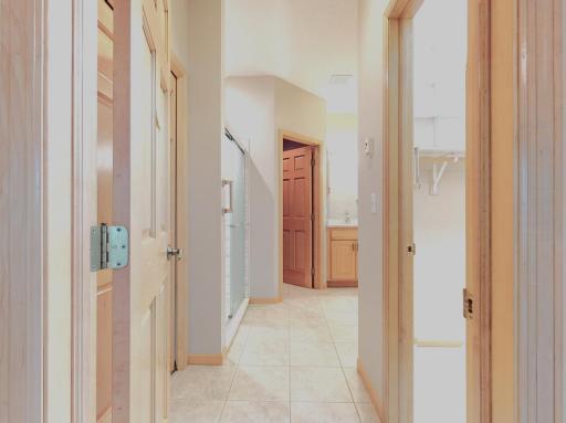 Primary bathroom with dual vanity / tile floor / custom walk-in tile shower