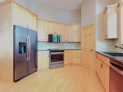 Stainless steel appliances / granite tops / tile backsplash / corner walk-in pantry
