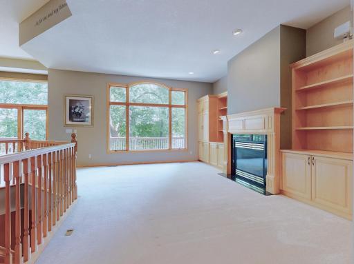 Large windows - gas fireplace w/ marble surround