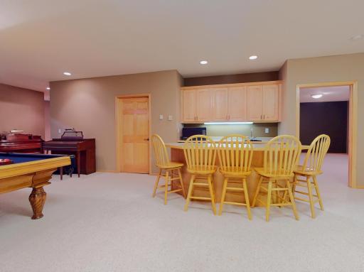 Wet bar - sink - mini fridge - cabinets - barstools included