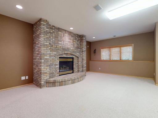 Family room with gas fireplace - brick to ceiling
