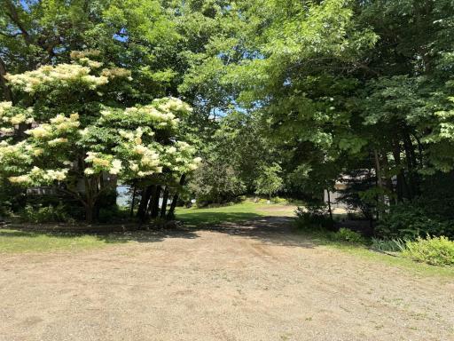 Drive down towards detached garage - outbuilding