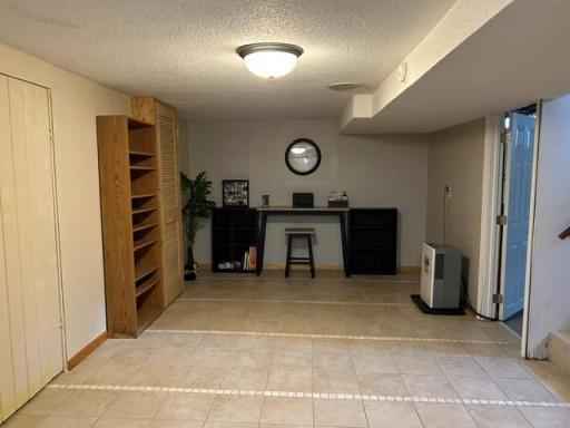 Finished lower level, space for office and crafting.
