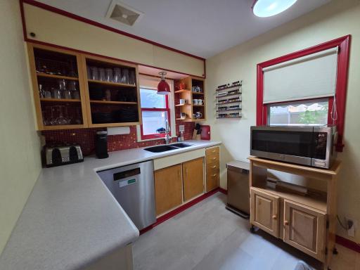 The doors in the soffit open- loads of storage there too! The window behind the microwave has views of the backyard.