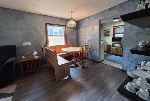 Another view of spacious dining area & floating shelves.