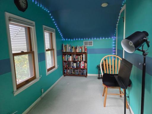 And to the left at the top of the stairs in the office- door on the right, and windows facing the back yard.