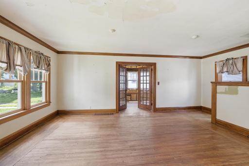 Living room with access to main floor sunroom