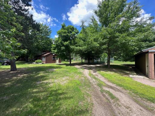 Heavily wooded with several outbuildings!