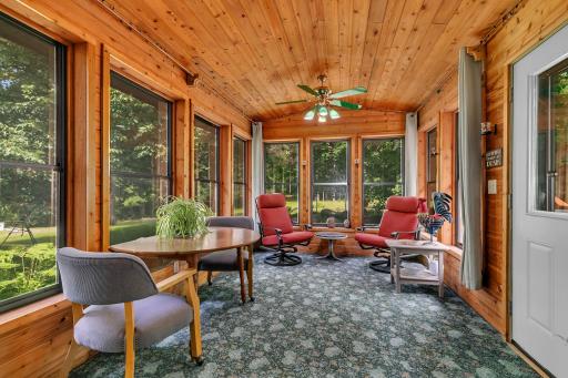 3 season porch off the dining room connects the home to the deck and gazebo