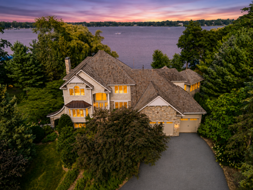 Incredible lakefront estate on prestigious Turtle Lake offering 2.8 private acres and over 300 feet of flat sandy shoreline. As the sun sets, the home takes on an entirely new level of warmth, elegance, and beauty.