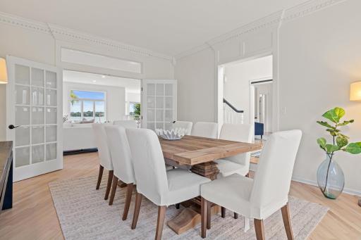 Whether hosting an intimate dinner or a large celebration, this sophisticated dining room showcases panoramic views of the estate's breathtaking grounds, offering beauty in every season.