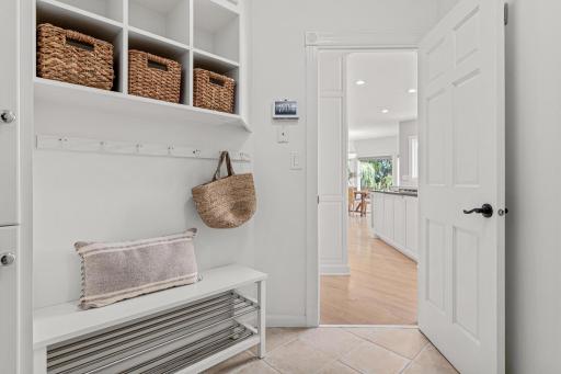 A spacious mudroom provides the perfect transition from the garage, featuring abundant storage and a dedicated drop zone for lake gear, outdoor equipment, and everyday essentials.