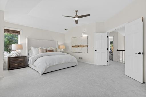 A true sanctuary, the primary suite occupies the perfect vantage point at the top of the landing, where sweeping lake views and peaceful surroundings create an extraordinary retreat within the home.