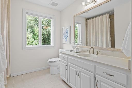 Beautifully appointed full bathroom with timeless finishes and quality craftsmanship.