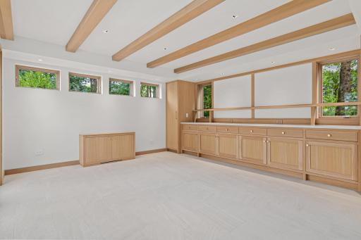 One of the property's most unique features- this professionally remodeled, temperature- and humidity-controlled space offers endless possibilities for a workshop, creative studio, home office, or gathering space.