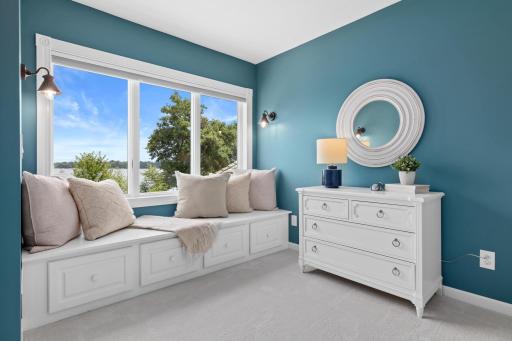 Curl up with your favorite book in this charming reading nook, where sweeping views of Turtle Lake create the perfect place to relax, reflect, and unwind.