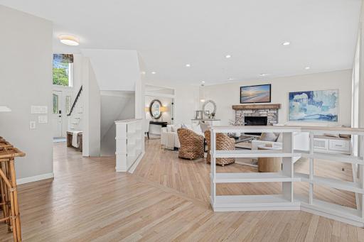 The thoughtfully designed open floor plan creates effortless flow between the gourmet kitchen, dramatic great room, and elegant dining room, providing the perfect setting for both intimate gatherings and large-scale entertaining.