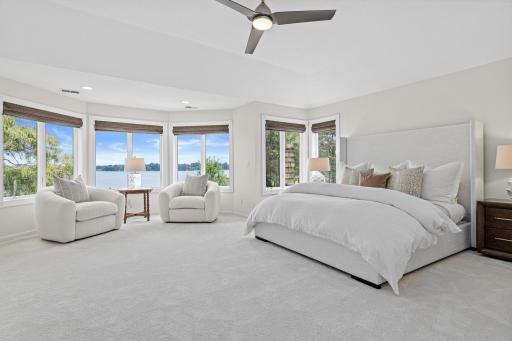 Wake each morning to tranquil lake views in this luxurious owner's retreat.