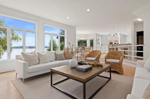 Walls of windows frame breathtaking lake views while the spacious gathering room offers the perfect place to relax or entertain.