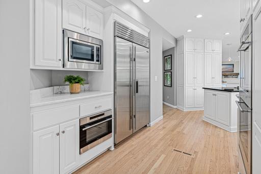 This chef inspired kitchen goes on and on. Abundant counter space and cabinet storage, high end appliances and multiple areas to prepare meals and entertain.