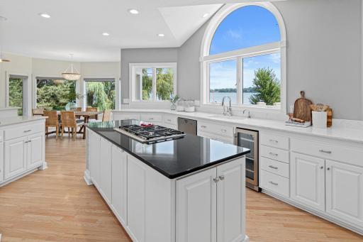 Expansive windows frame the picturesque landscape, creating an ever-changing backdrop that makes this kitchen truly one of a kind.