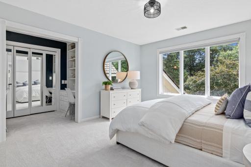 One of the upper-level bedrooms is exceptionally spacious, featuring a large closet and two dedicated built-in desk areas- ideal for studying, working remotely, creative projects, or getting ready.