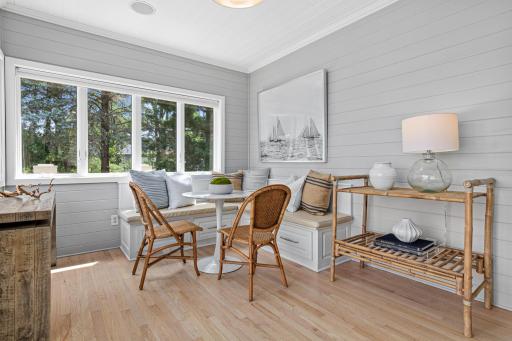 The "breakfast room" designed for morning coffee, evening conversations, and enjoying the beauty of Turtle Lake. Convenient access to the deck, gazebo, and outdoor living spaces makes lakefront living effortless.