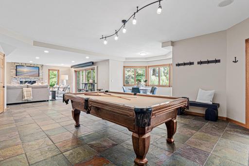 The finished walk-out lower level offers a true entertainment destination, thoughtfully designed with a billiards area, card area and more.