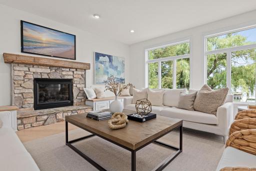 The great room has been freshly painted, hardwood floors refinished, new light fixtures installed and is ready for you to move in. Beautiful stone fireplace, walls of windows and natural woodwork provide a blank slate for your decorating ideas.