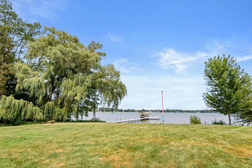 Wide-open green space meets the water's edge, offering the perfect backdrop for active afternoons and relaxed lakeside living.
