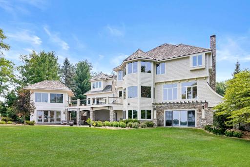 Expansive lakeside lawn offers endless space for football, soccer, lawn games, and unforgettable family gatherings.