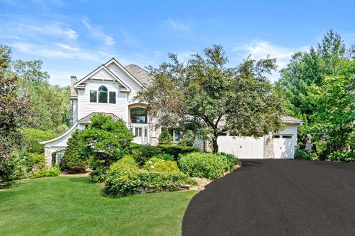 Carefully selected trees, flowering shrubs, and perennials create a landscape that evolves from spring through fall.
