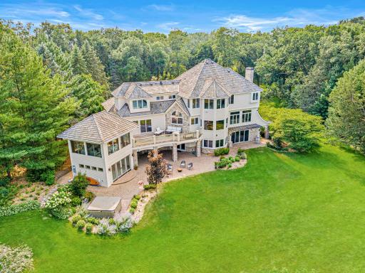 A truly extraordinary setting featuring nearly three acres of park-like grounds, a winding driveway, mature trees, ever-changing perennial gardens, and over 300 feet of pristine, level sandy shoreline on Turtle Lake.