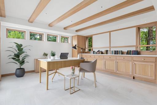 Detached lower-level room visually staged as an office. Multi-purpose room may be used in many different ways.
