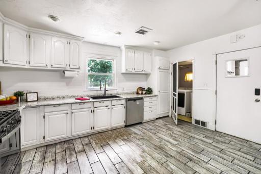 Large open kitchen with main floor laundry to the right