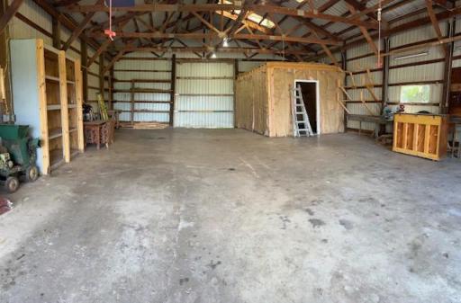 Inside the shed with the tack room in the corner