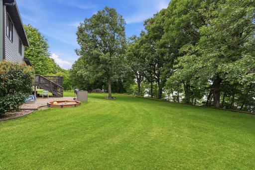 Landscaped ATV trail and stairway lead down to the water.