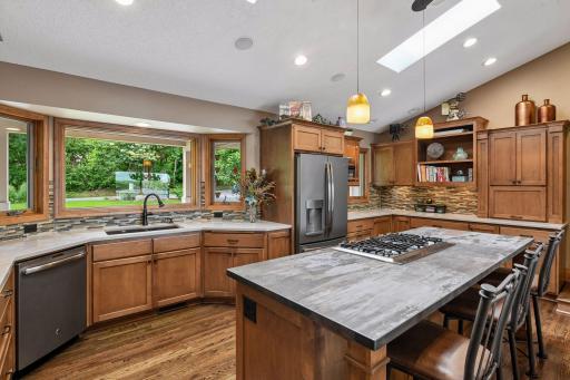 Oversized center island with Silestone countertop.