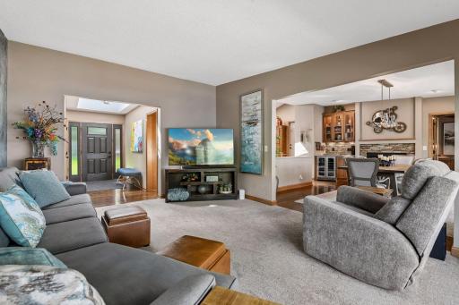 Living room adjoins front entry and the formal dining.