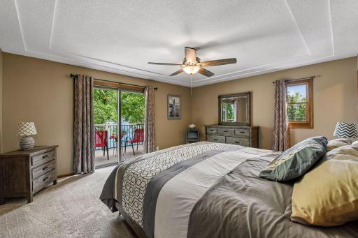 Mater bedroom with sliding door to a master deck.