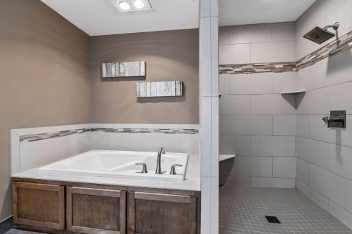 Master bath has separate shower and jetted tub.