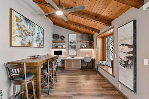 Main floor office has vaulted ceiling, built-in desk & bay window.