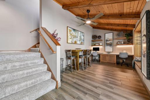 The office has steps to a bonus room over the garage.