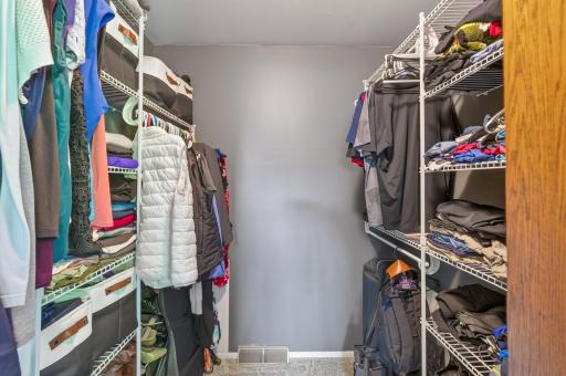 Primary bedroom's walk-in closet is large and well organized!