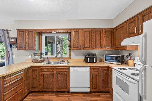 Newer floors and kitchen sink, plus a window overlooking the backyard.