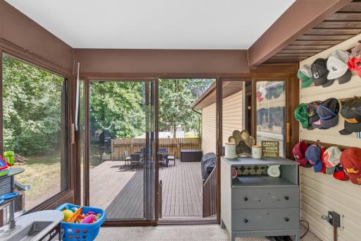 Steps down to the expansive, custom-built deck.